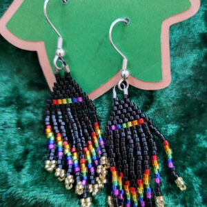 Woven bead earrings in a fringed triangular pattern, mostly black but with rainbow accents on the base and fringe.